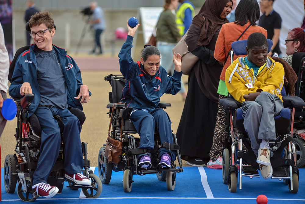 A group of young people playing Boccia