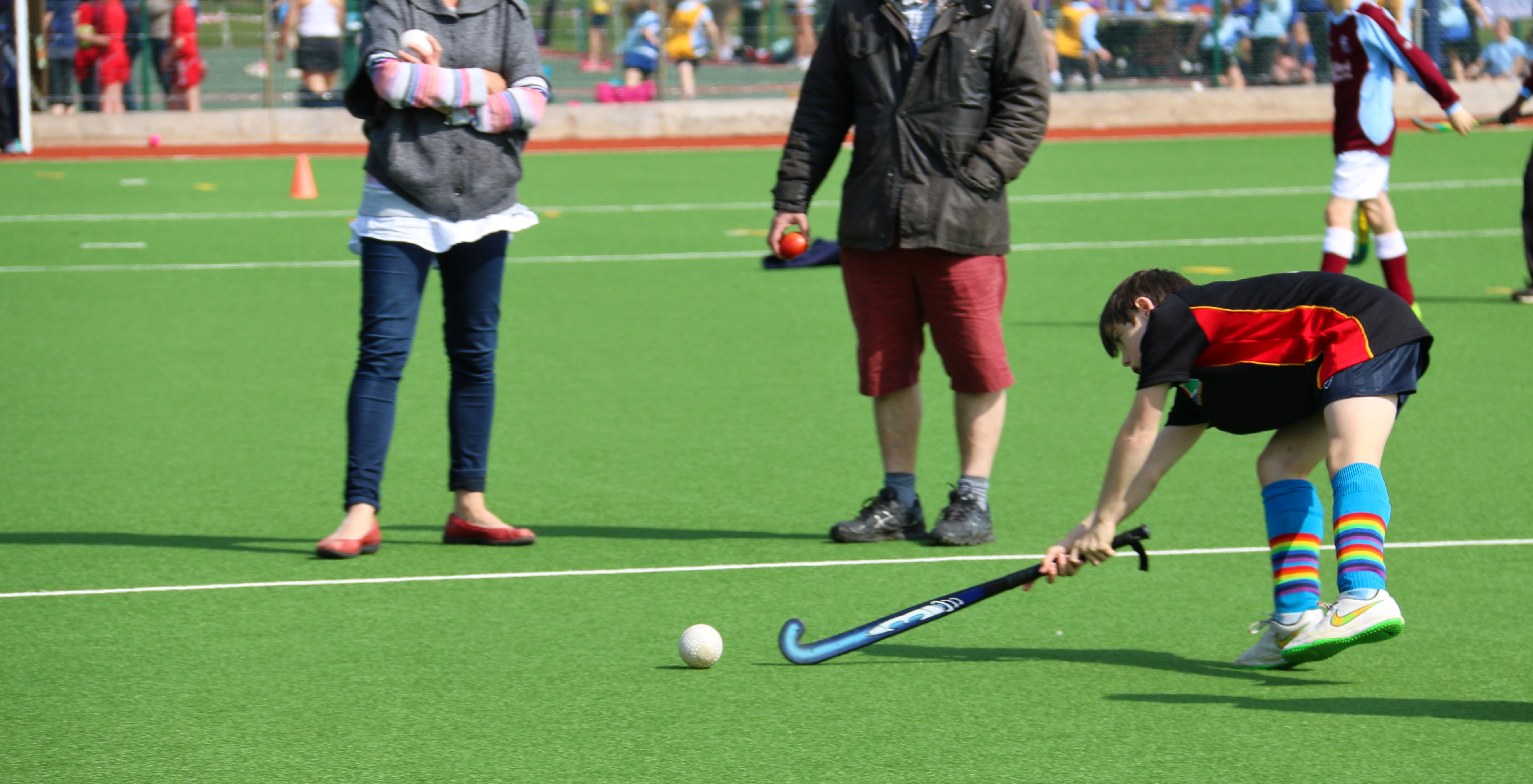 Boy hitting a hockey ball 