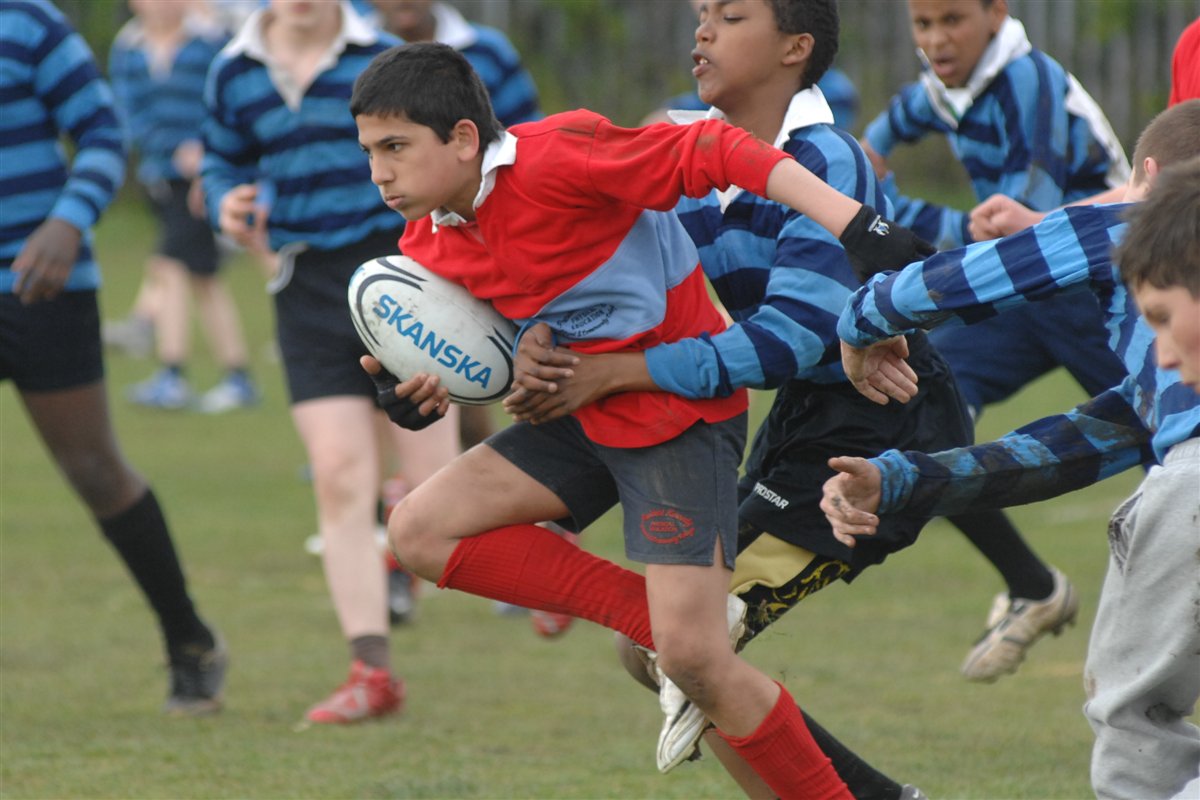 Boy playing rugby union