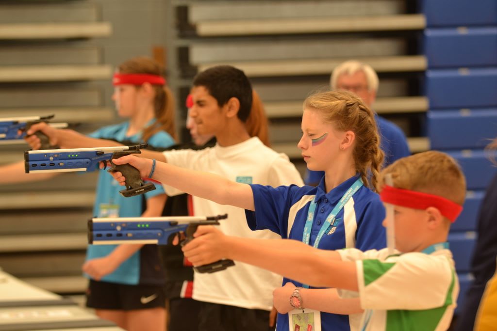 A group of young people target shooting