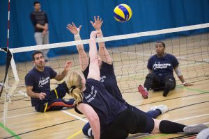 People playing sitting Volleyball