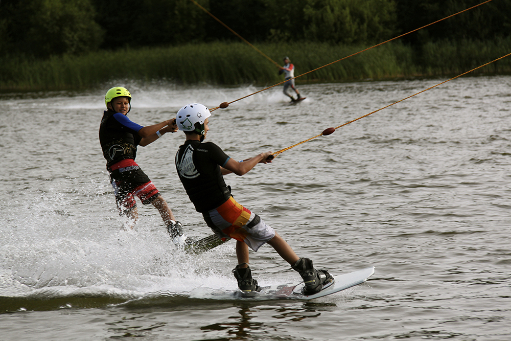 Two boys wakeboarding 